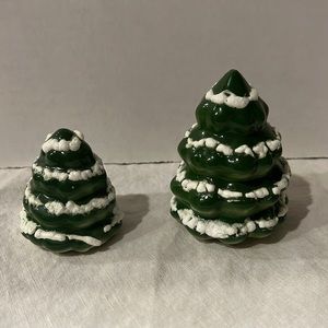 2 little ceramic Christmas trees, different sizes.
